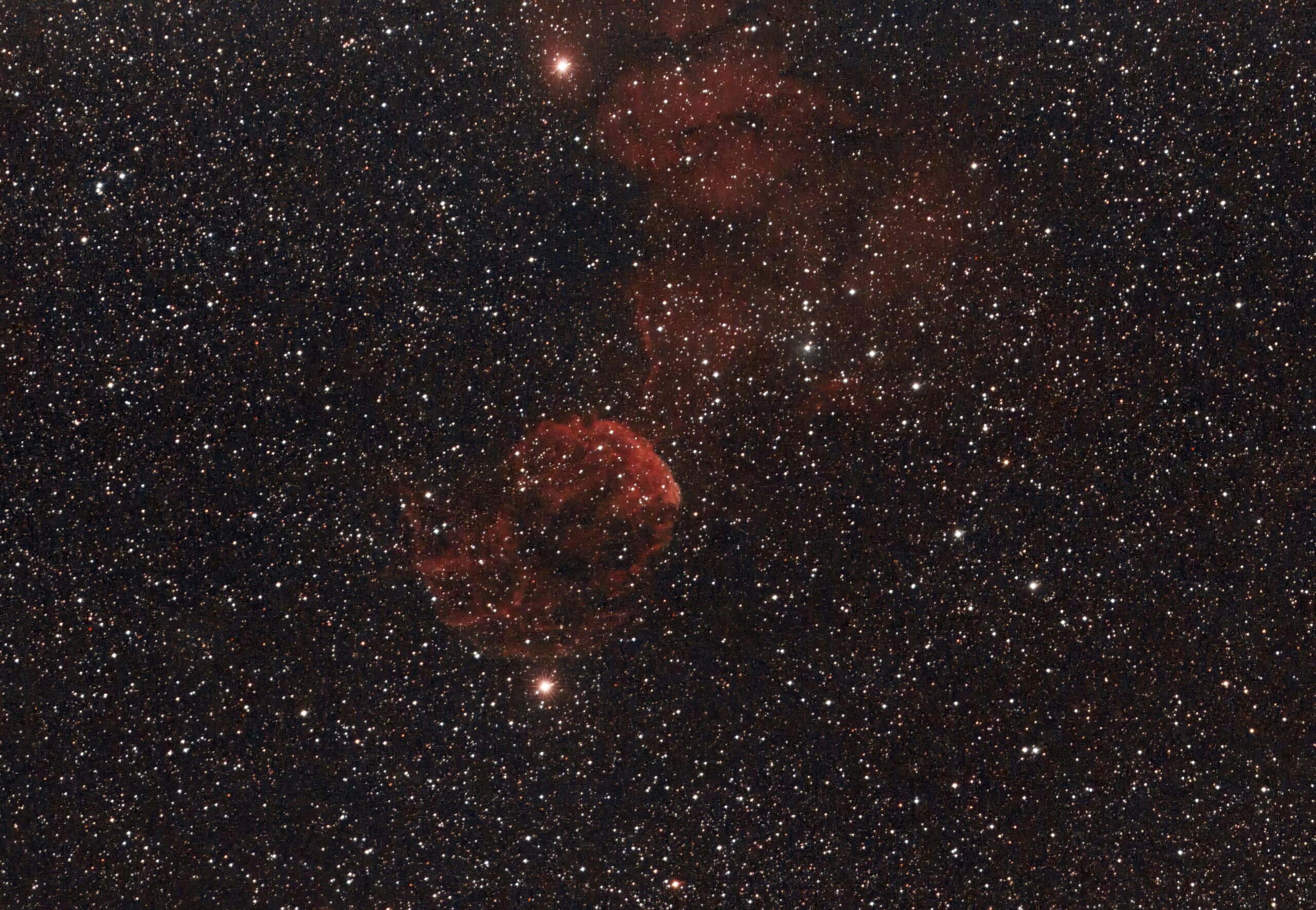 Captured nebula amidst a vast star field, revealing the beauty of space.